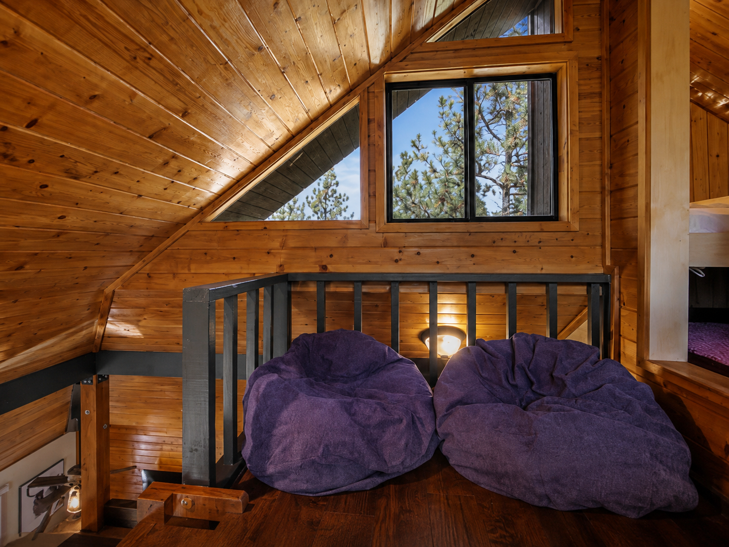 Relaxing loft lounge with bean bags in mountain cabin