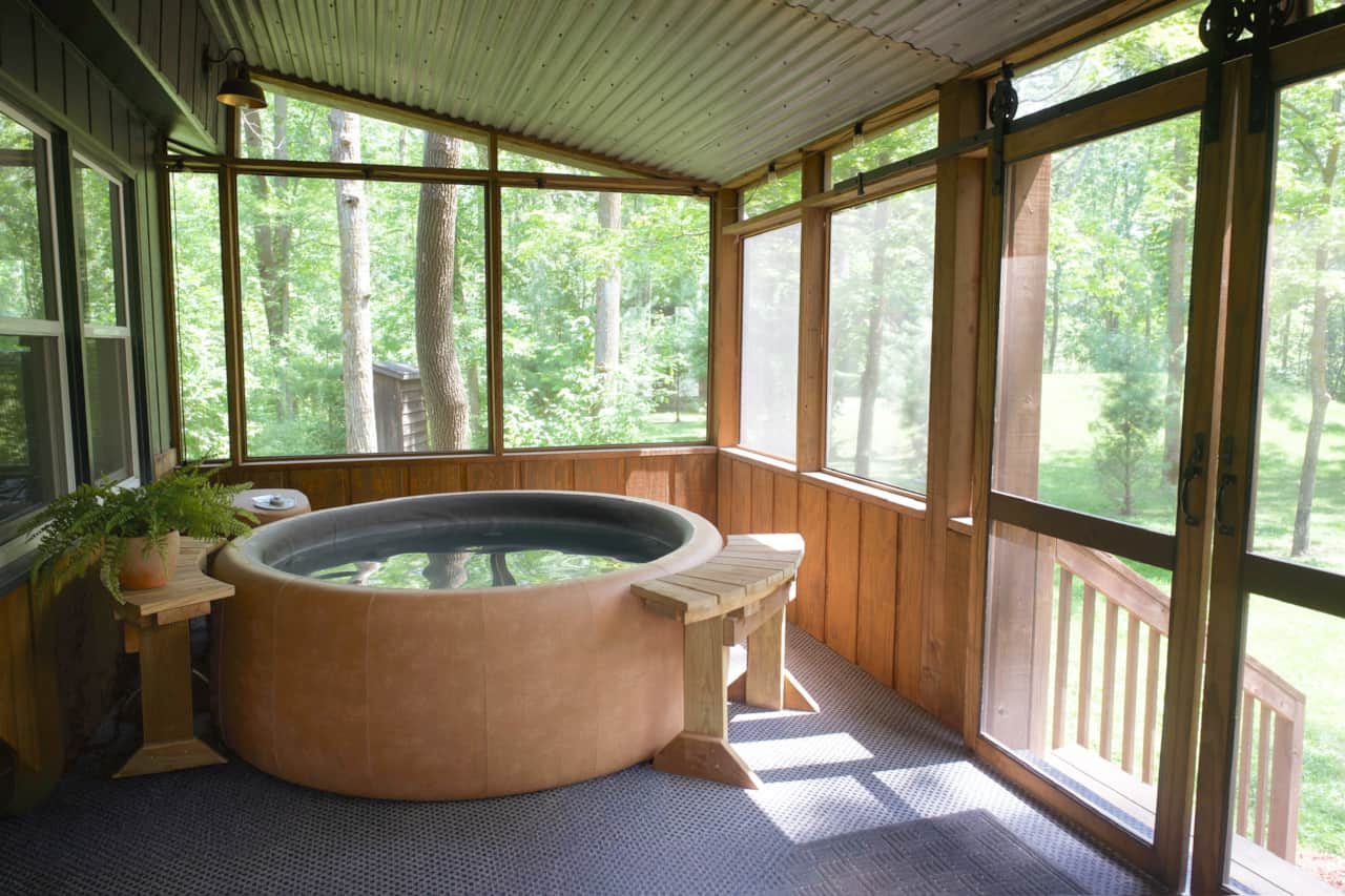 Relax rain or shine in the private hot tub