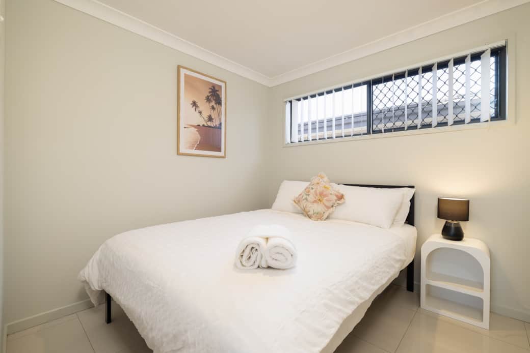 Bedroom 1: Peaceful bedroom with cozy design and ample storage