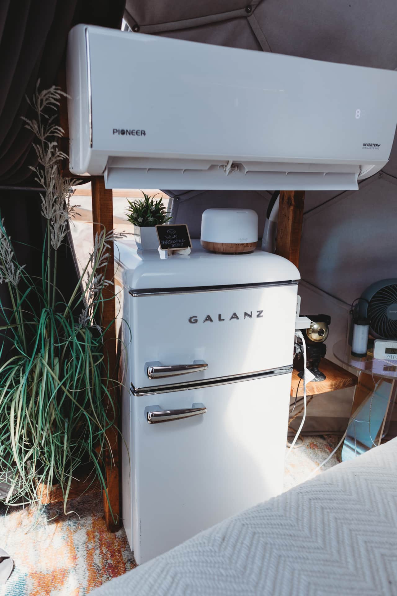 Retro fridge and modern comforts inside Space Pod 010