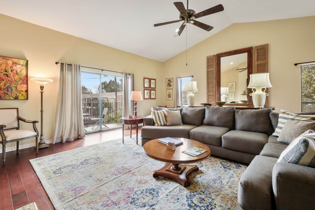 Open living room with sectional sofa. 