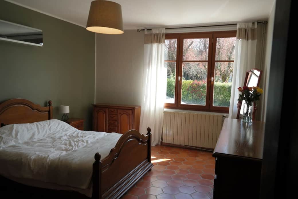 Bedroom 1 with queen bed and air conditioning