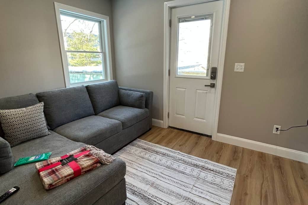 Enter into the living space with a pull out sleeper sofa and 50" TV