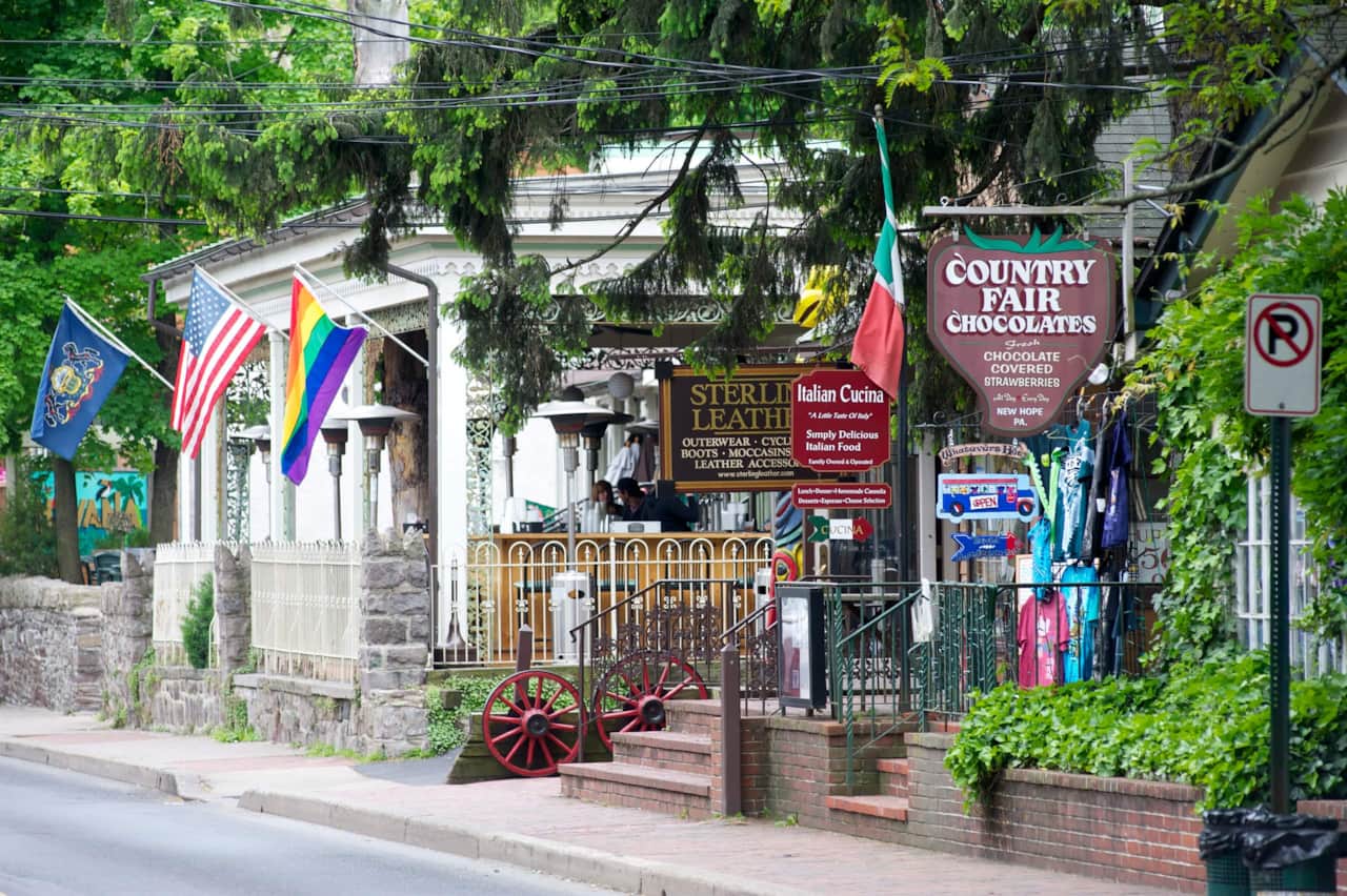 Shops and colorful flags along a street in New Hope