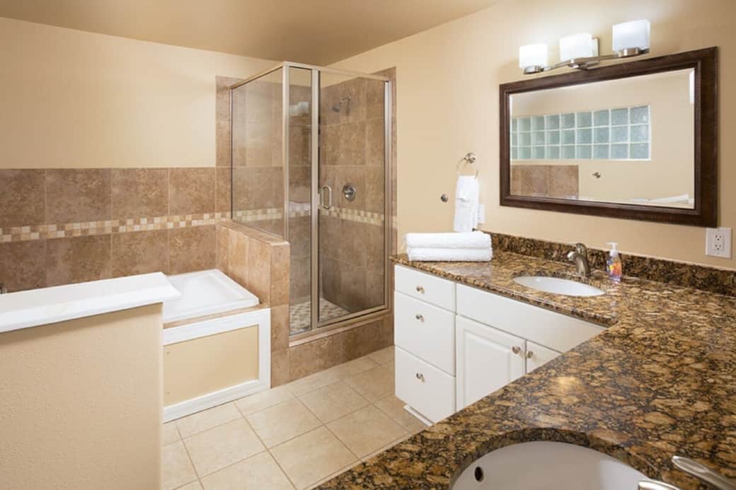 The master bath is large and has a jetted tub and shower.