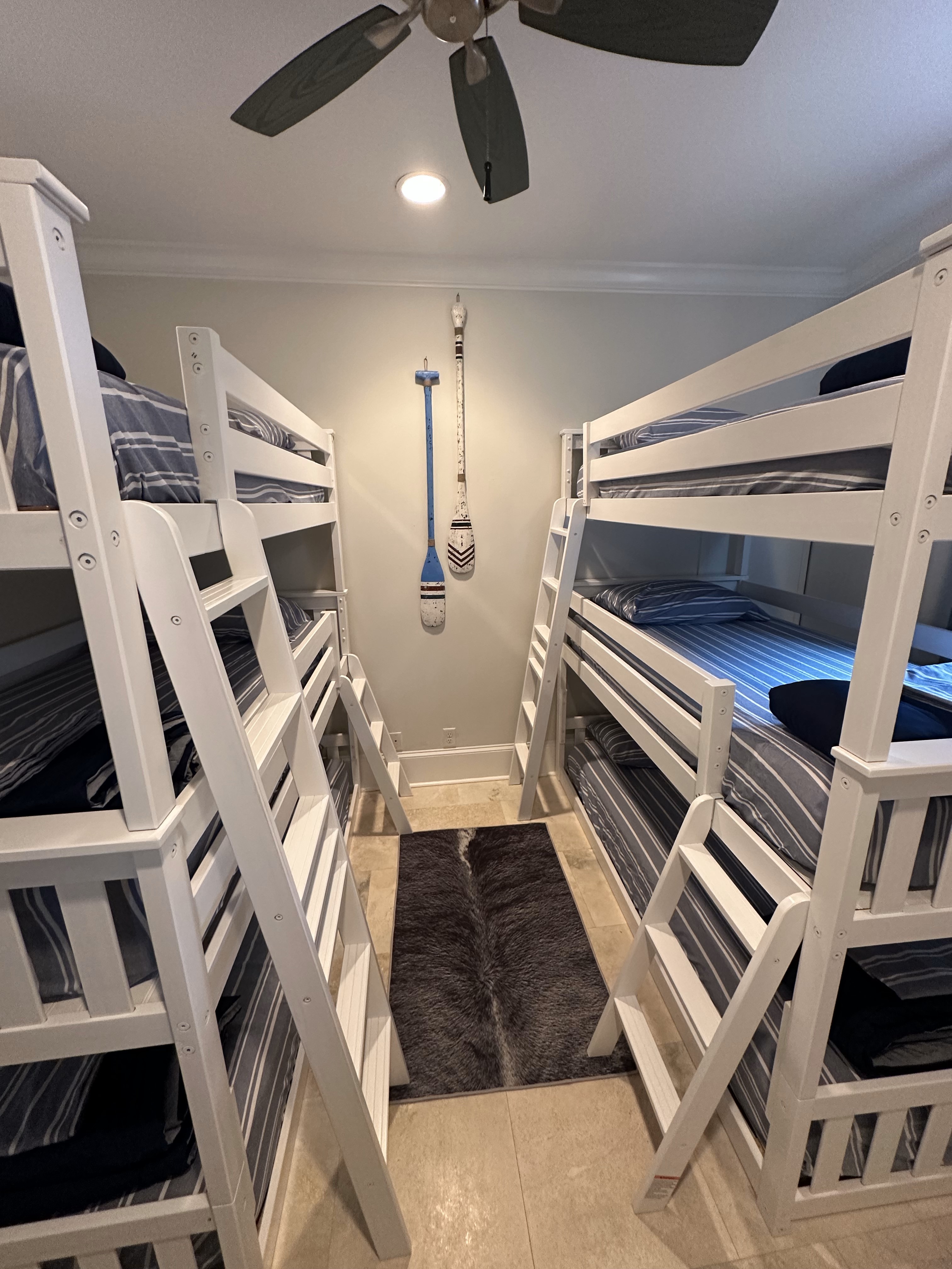 Fourth floor bedroom with two twin triple bunk beds, tv and ensuite.