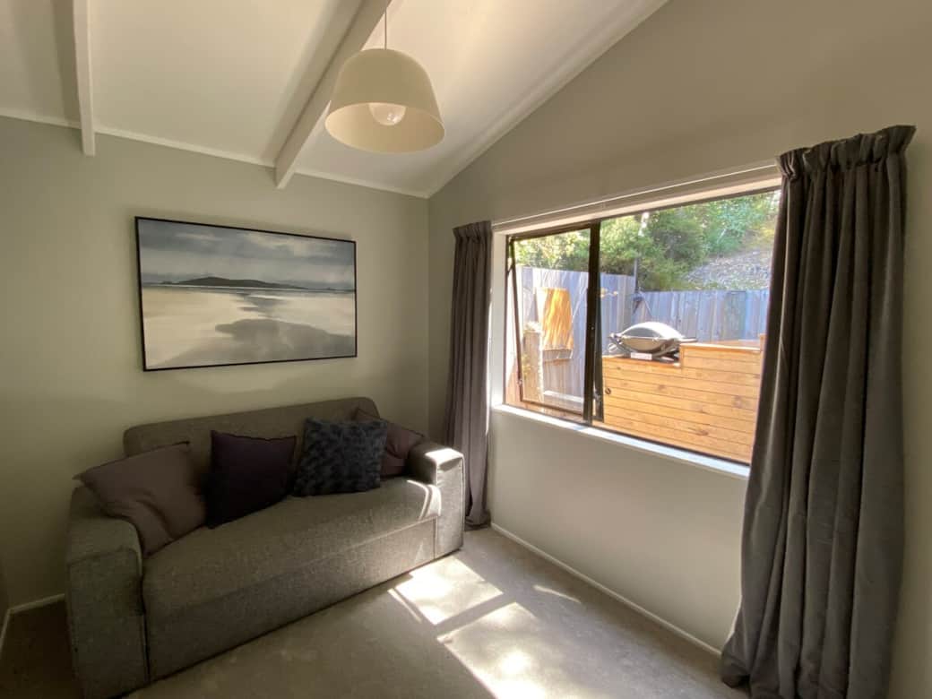 Master bedroom with queen bed, sofa bed and deck access. (sleeps up to 4)