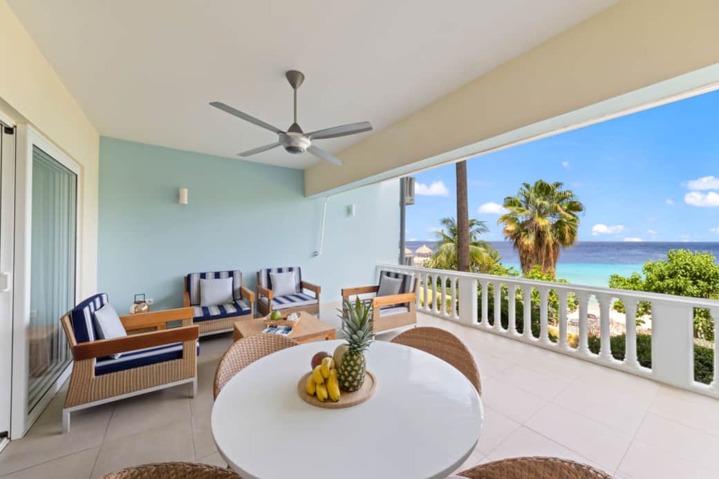 Spacious balcony with a lounge set, dinner table, day beds, sunscreen and ceiling ventilator Spacious balcony with a lounge set, dinner table, day beds, sunscreen and ceiling ventilator