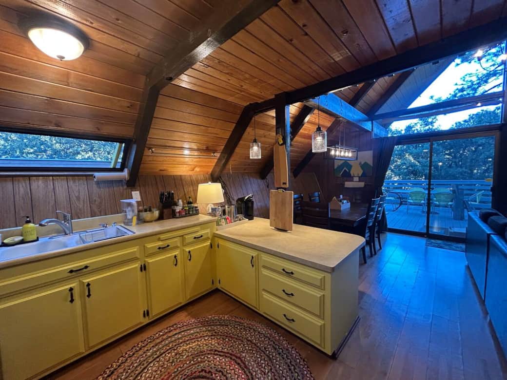 -Low counter is perfect for rolling out things and for little helpers to join in the fun.
-Kitchen opens to living/dining room with two-story windows looking out onto protected forest
-Three cutting boards and a charcuterie board -Low counter is perfect for rolling out things and for little helpers to join in the fun.
-Kitchen opens to living/dining room with two-story windows looking out onto protected forest
-Three cutting boards and a charcuterie board