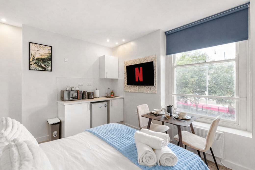 right and stylish bedroom featuring a plush double bed with luxury linens, right and stylish bedroom featuring a plush double bed with luxury linens,