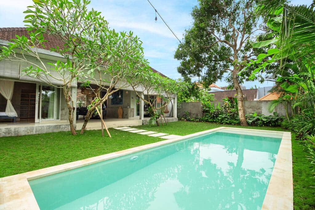 Spacious green backyard with private pool and garden