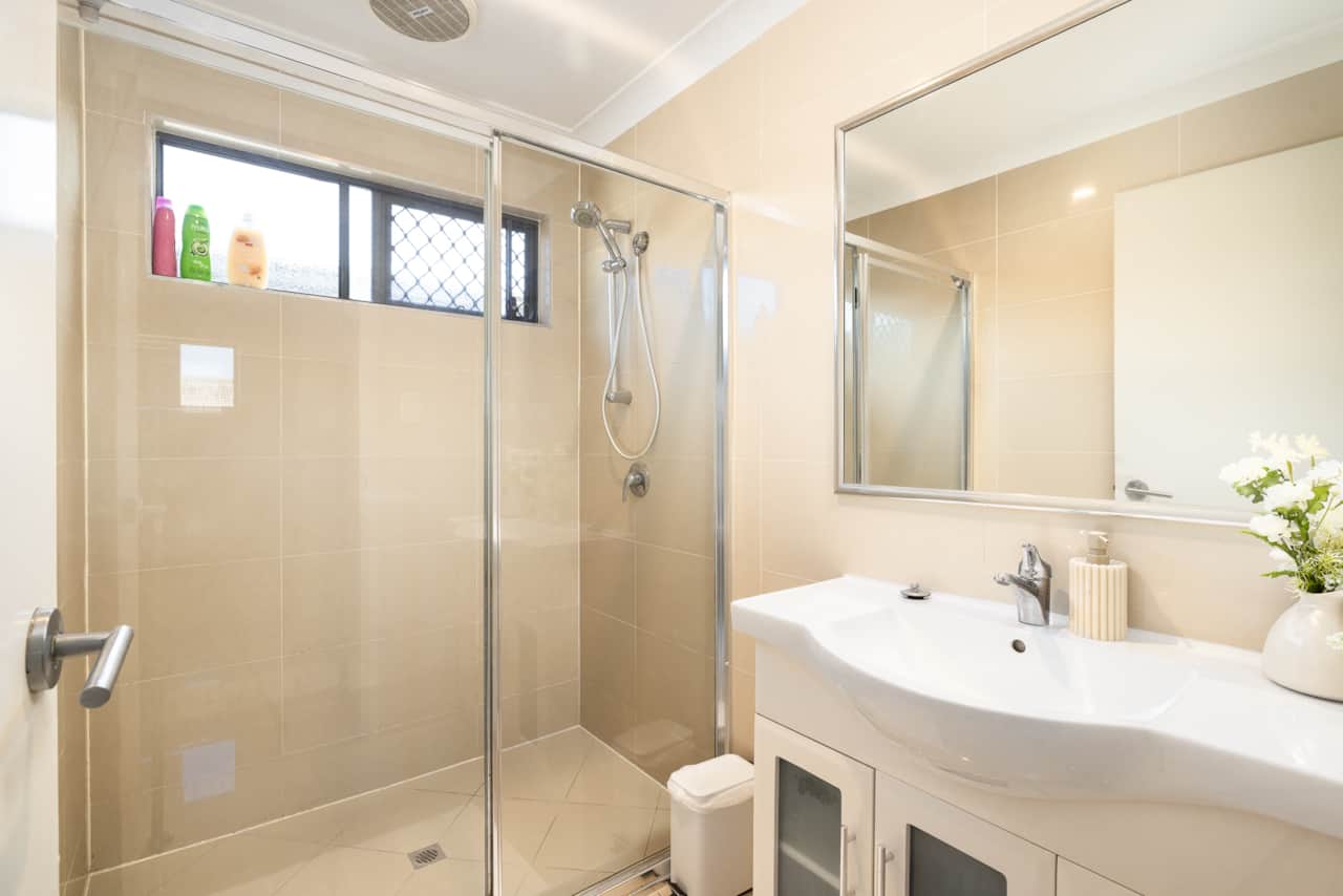 Bathroom: Stylish bathroom with walk-in shower, vanity, and clean finishes 