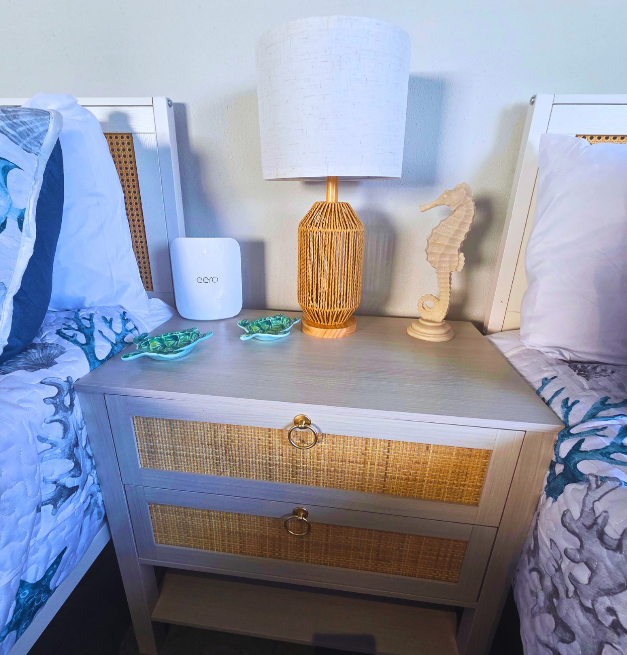 Coastal decor with sea turtles, a seahorse, and a charming bedside lamp. Treasure Island, FL