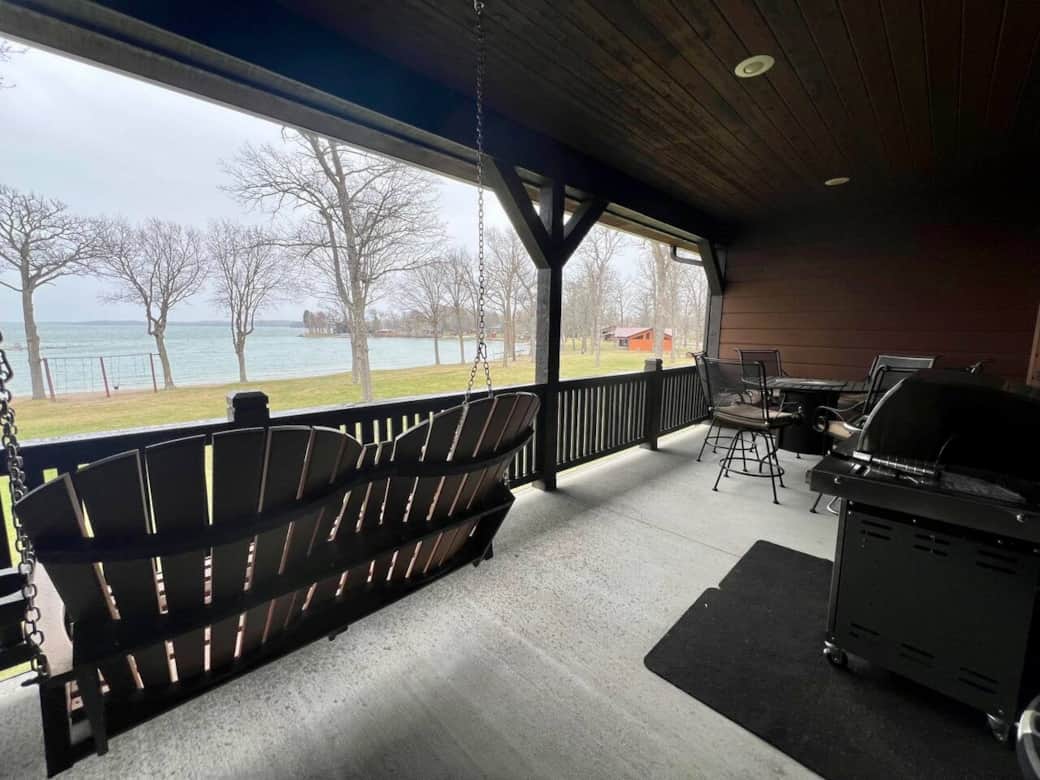 The porch area with grill and firetable that seats 6