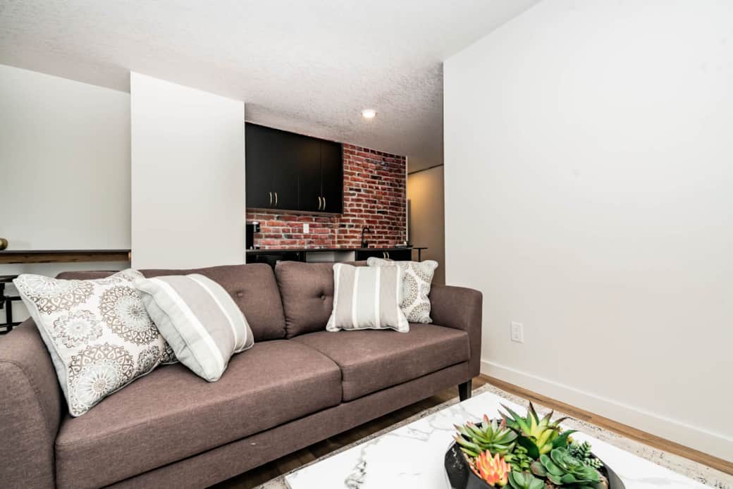 living room with smart tv and couch living room with smart tv and couch