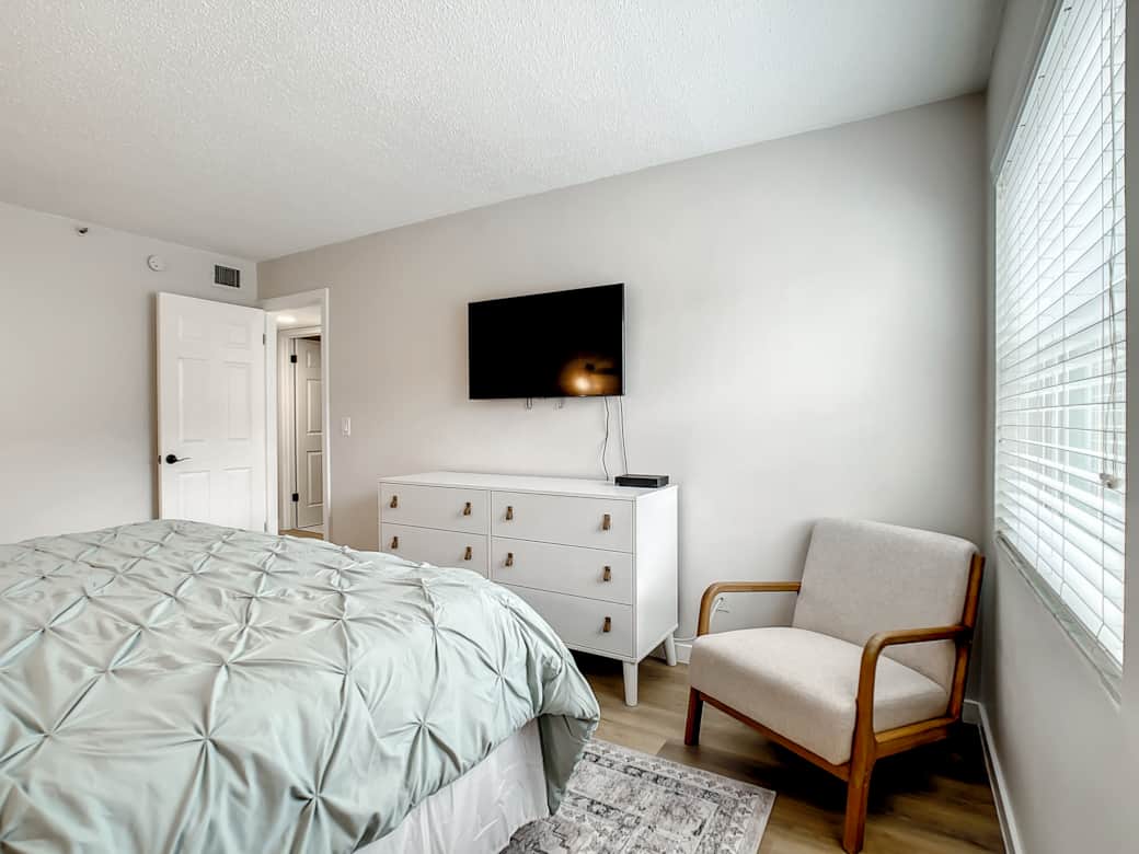 Primary bedroom at Gulf Coast 107 with a comfortable king-size bed and calming décor.