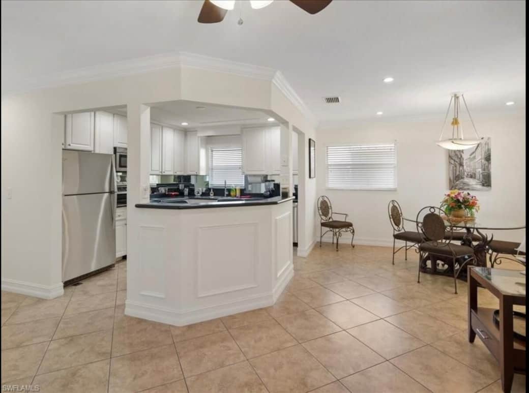 Open floor plan with living, dining and kitchen bar!