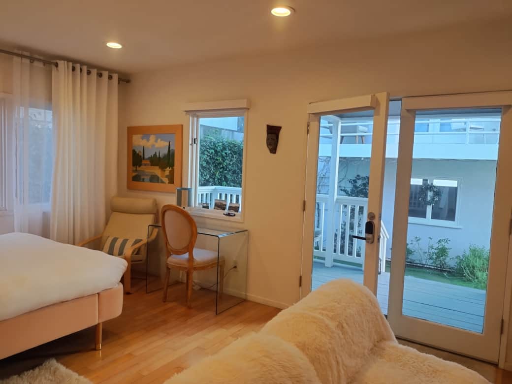 View to courtyard, french doors with shades View to courtyard, french doors with shades