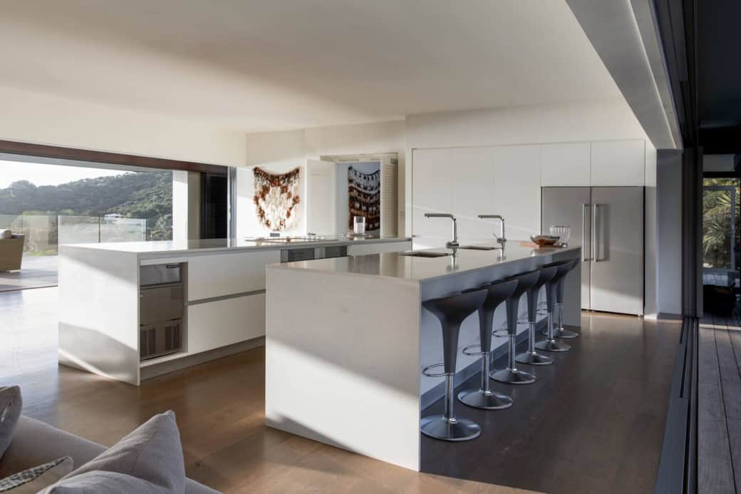 The kitchen features a commercial ice maker, twin dishwashers, tubs and fridges