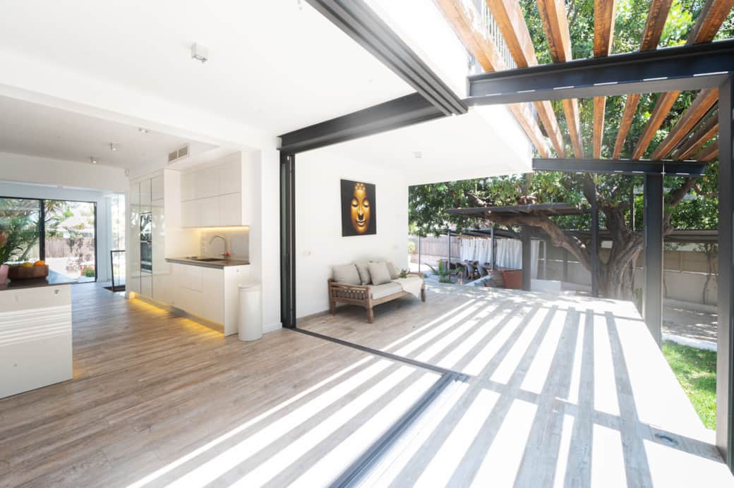Indoor-outdoor terrace with sliding glass doors at Casa Guindilla in Portals Nous, Mallorca