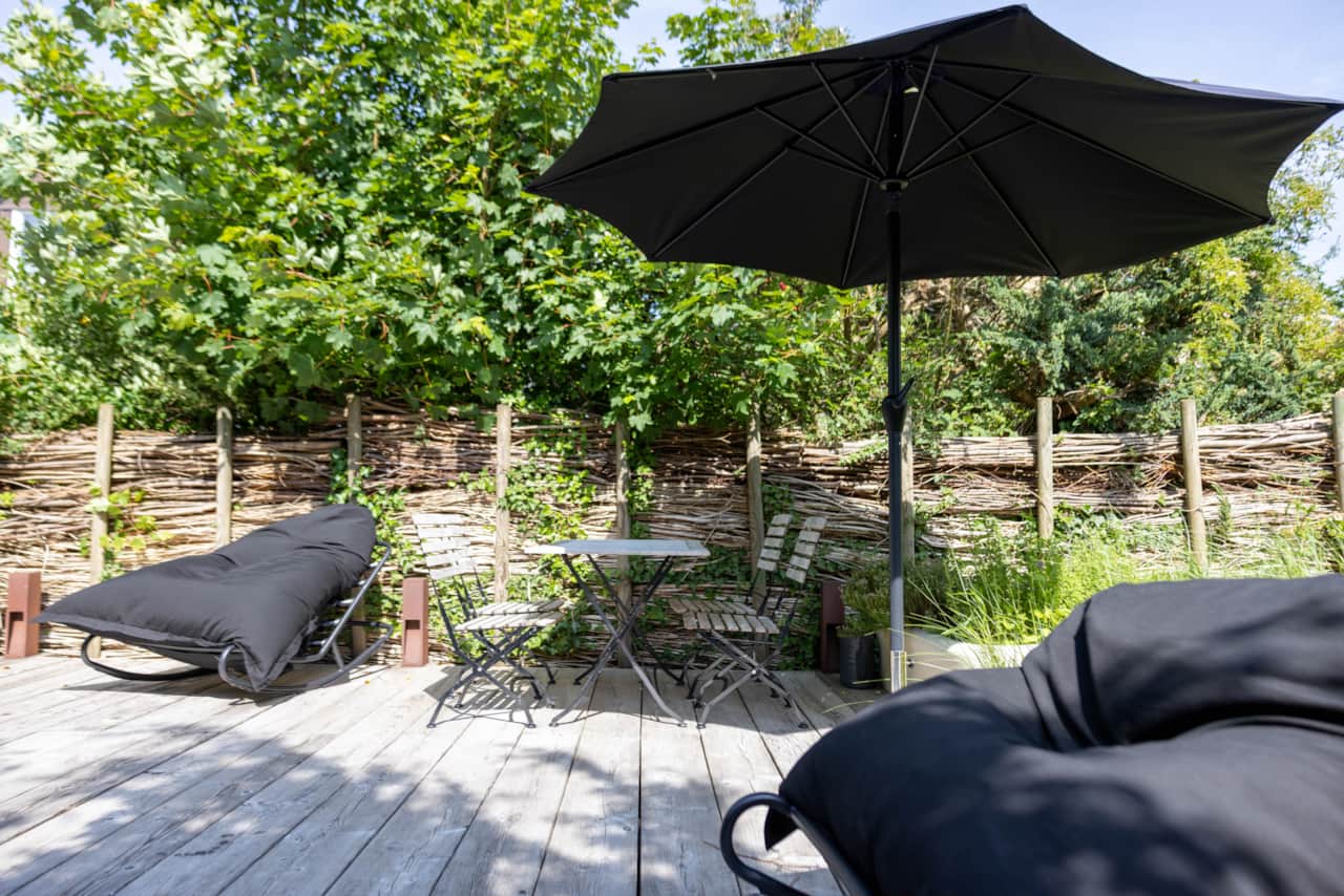Garden terrace with parasol