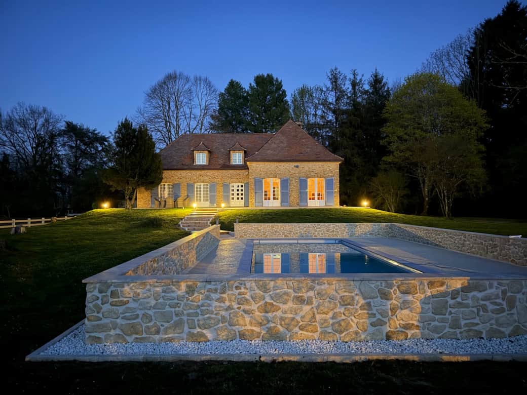 Beautiful illuminated pool at a Dordogne holiday rental