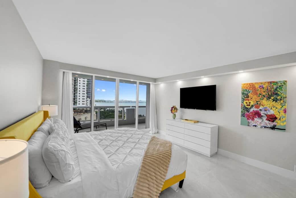 Master bedroom suite, king bed, Roku streaming tv, balcony access, water and park views, desk, walk in closet, master bathroom