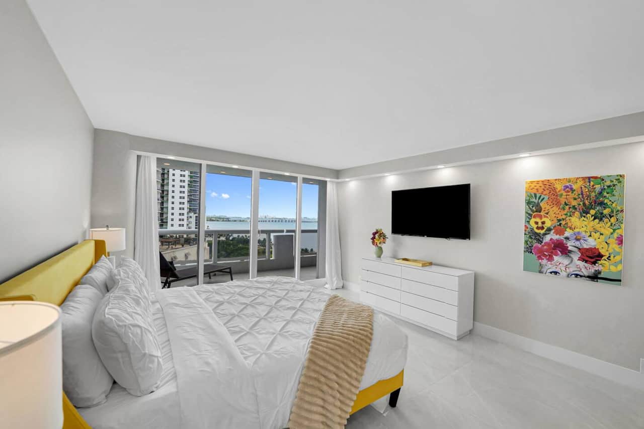 Master bedroom suite, king bed, Roku streaming tv, balcony access, water and park views, desk, walk in closet, master bathroom