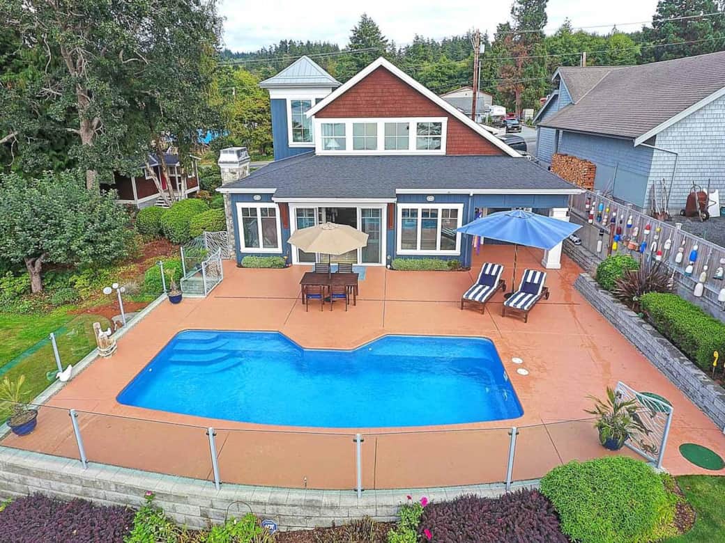 The pool deck provides a perfect place to relax or splash. The glass wall on separating the property from the neighbors has been replaced with a privacy planter. The pool deck provides a perfect place to relax or splash. The glass wall on separating the property from the neighbors has been replaced with a privacy planter.