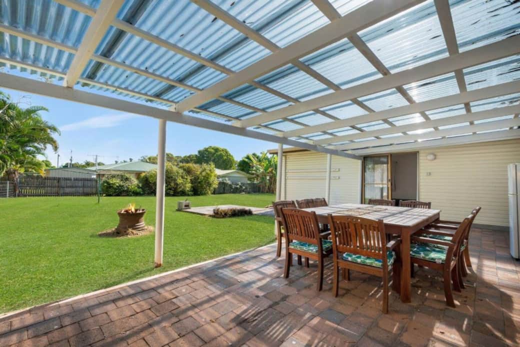 Covered outdoor dining with firepit and BBQ