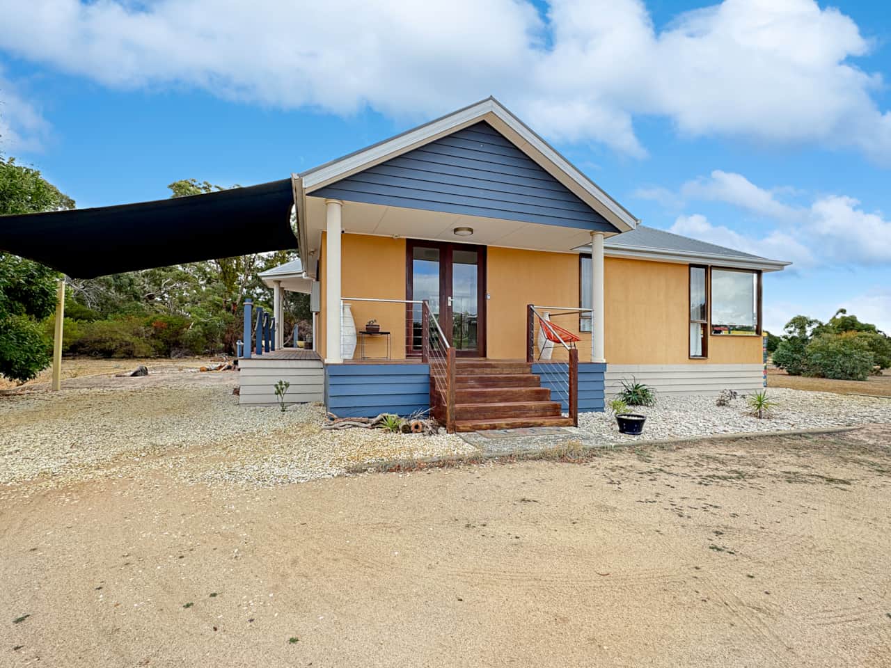 Charming front facade sets tone for idyllic retreat. Perfect home away from home!
