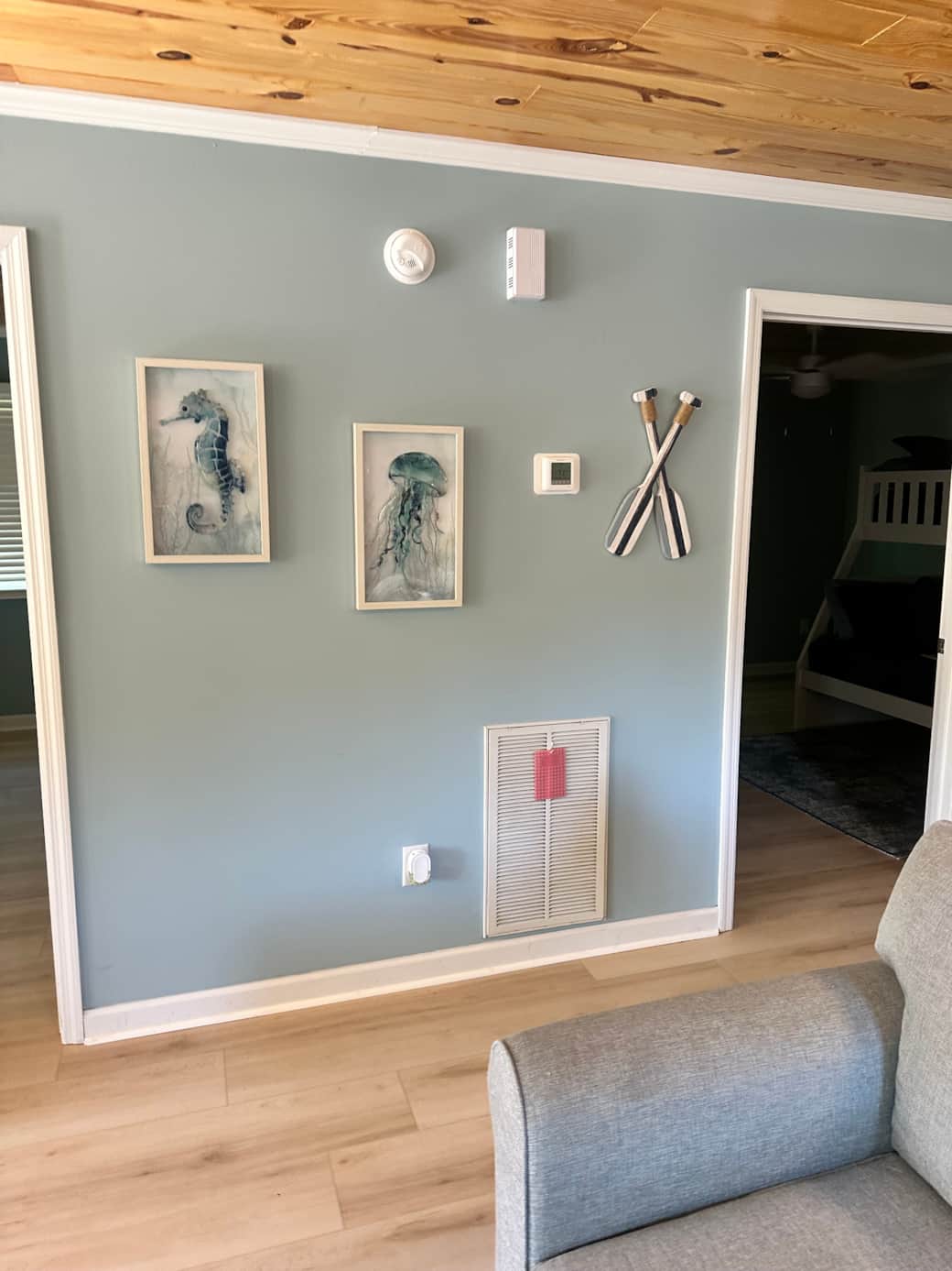 Coastal artwork in the hallway