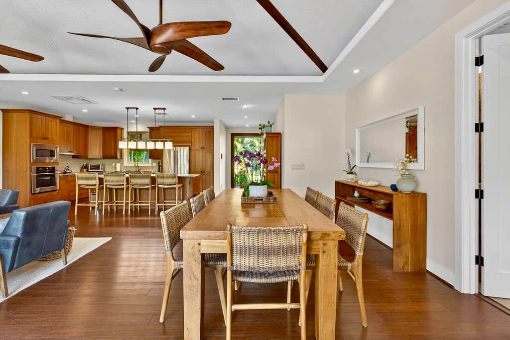 Gorgeous open concept with a large dining table and bar seating.