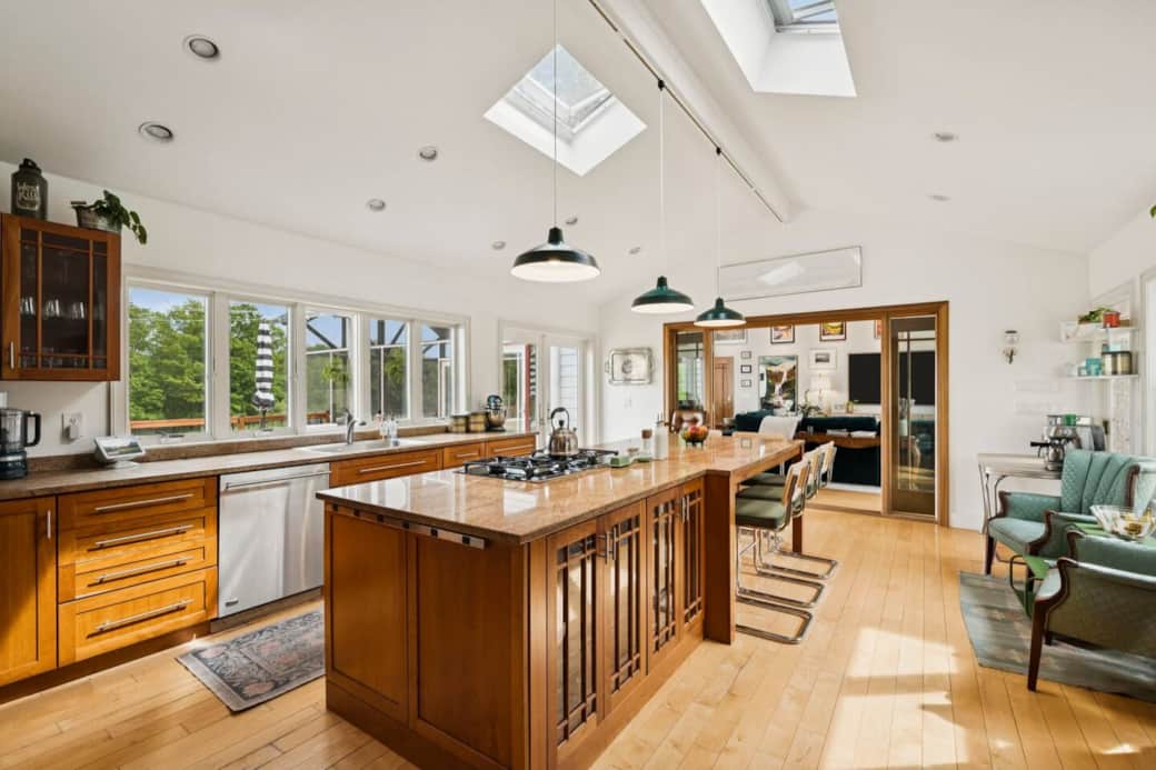 A large central island and seating area is great for group gathering in the central kitchen.