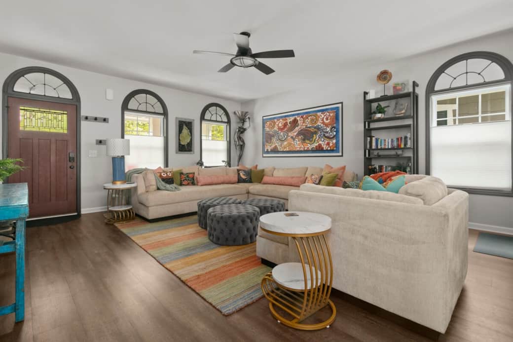 Bright open-concept living room with comfortable seating, natural light, and upscale coastal design for relaxing group stays. Bright open-concept living room with comfortable seating, natural light, and upscale coastal design for relaxing group stays.