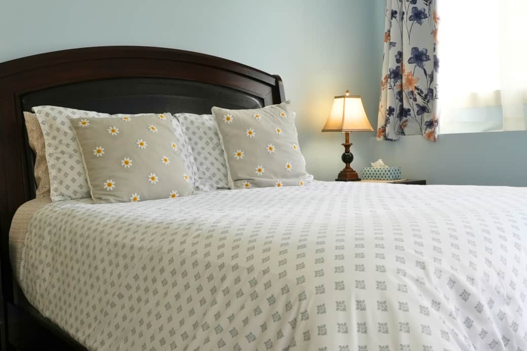Queen bed with private ensuite, balcony, closet and dresser