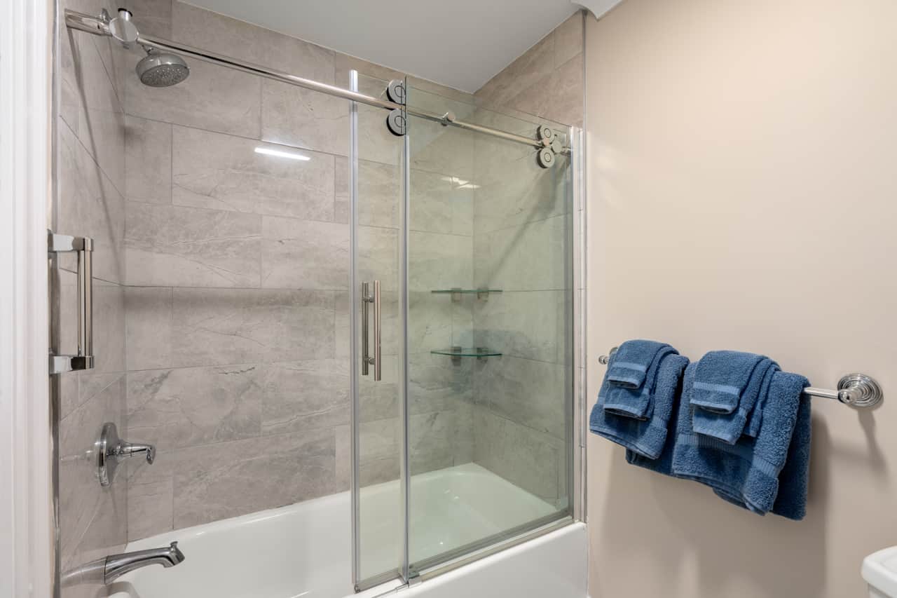 Renovated bathroom with shower/tub combo. 