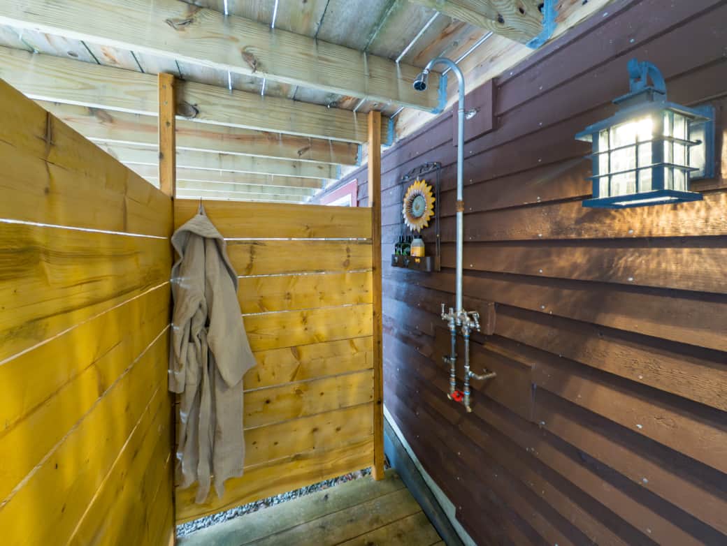 The outdoor shower equipped with biodegradable soap, shampoo and conditioner.