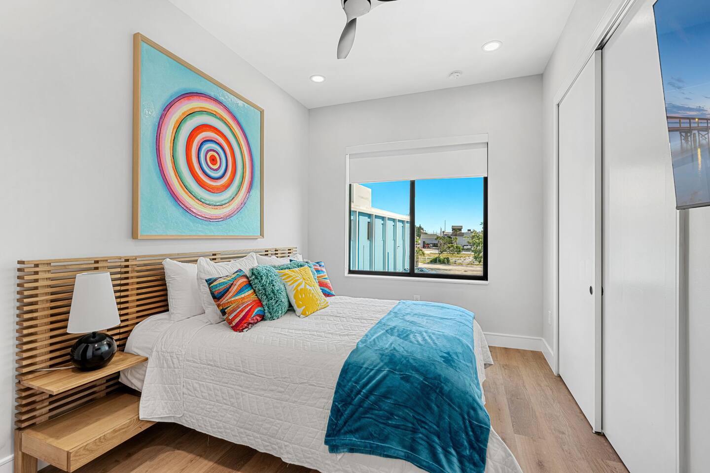 Vibrant decor and plenty of space in bedroom 4, featuring a king size bed and a TV.