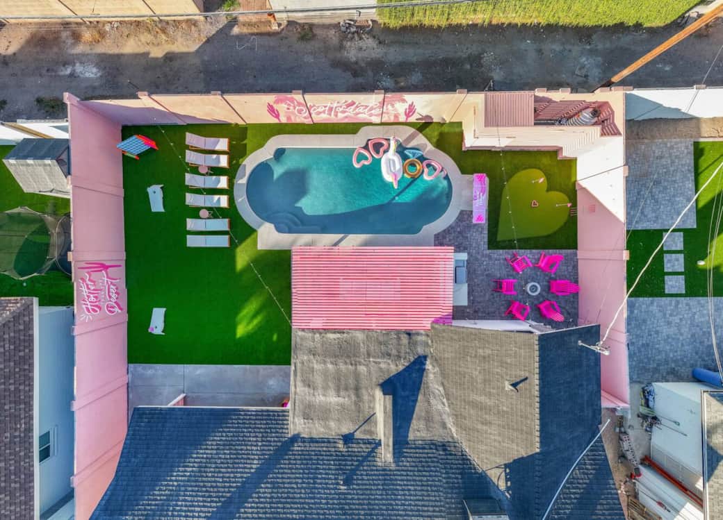 Resort style backyard features huge pool (includes pool floats), heart shaped mini golf, 2 iconic murals, pink fire pit area, oversized games. Bonus outdoor living room, outdoor dining space for 14 under the pink pergola, covered outdoor livingroom Resort style backyard features huge pool (includes pool floats), heart shaped mini golf, 2 iconic murals, pink fire pit area, oversized games. Bonus outdoor living room, outdoor dining space for 14 under the pink pergola, covered outdoor livingroom