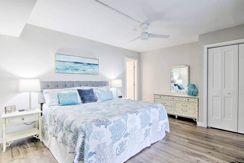 The primary bedroom is spacious and serene.