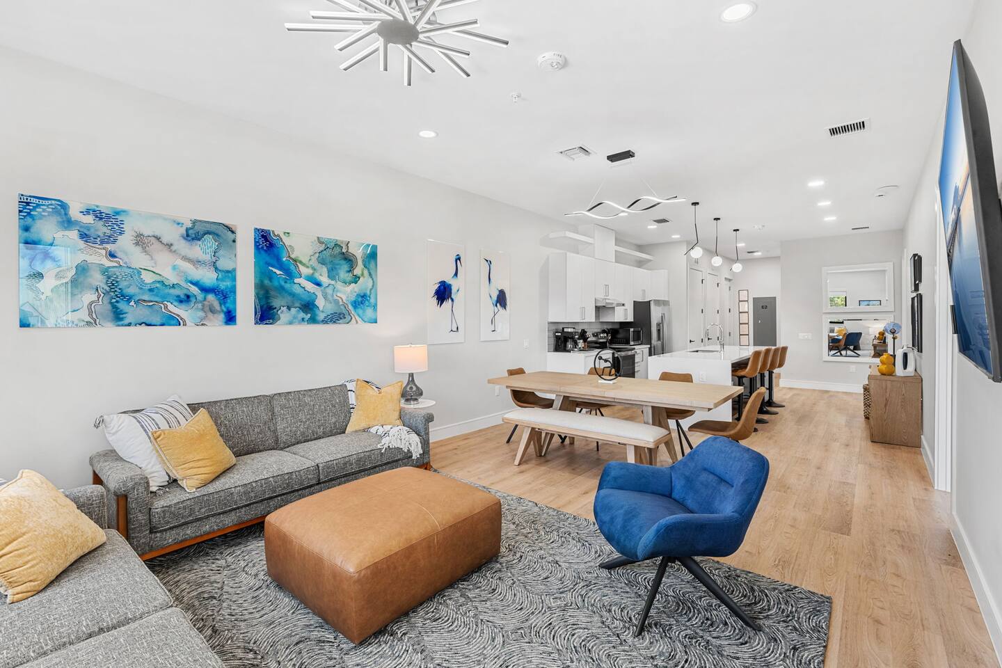 Enjoy casual lounging in this modern living area that combines with the kitchen.