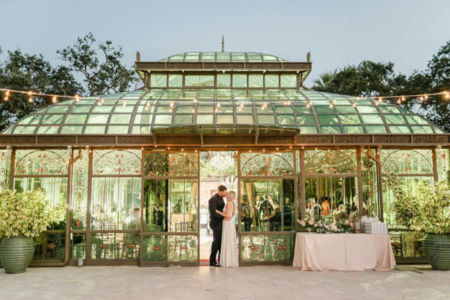 Glass conservatory wedding ceremony setup inside The Bryan Museum