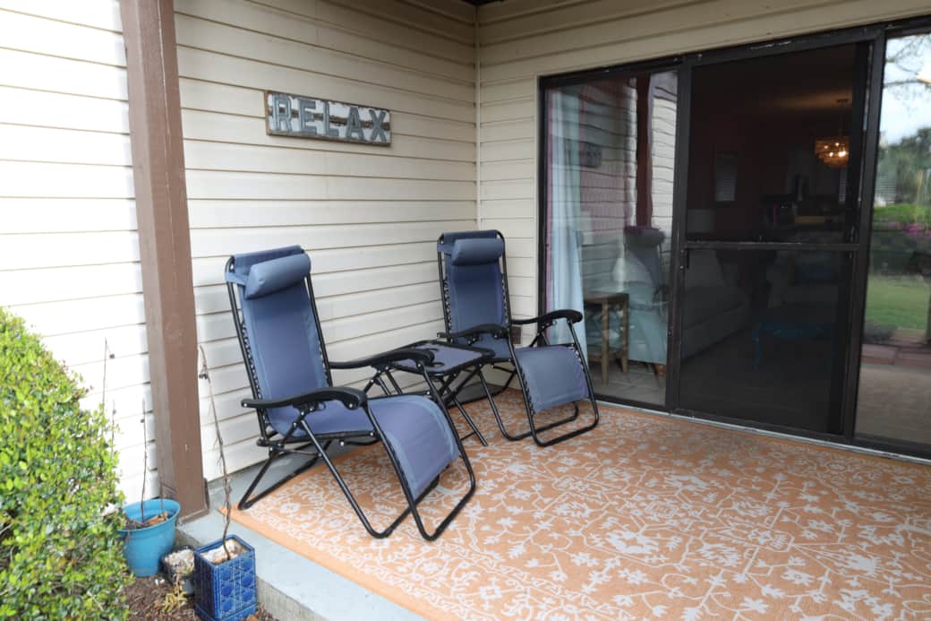 Back of condo with outdoor patio