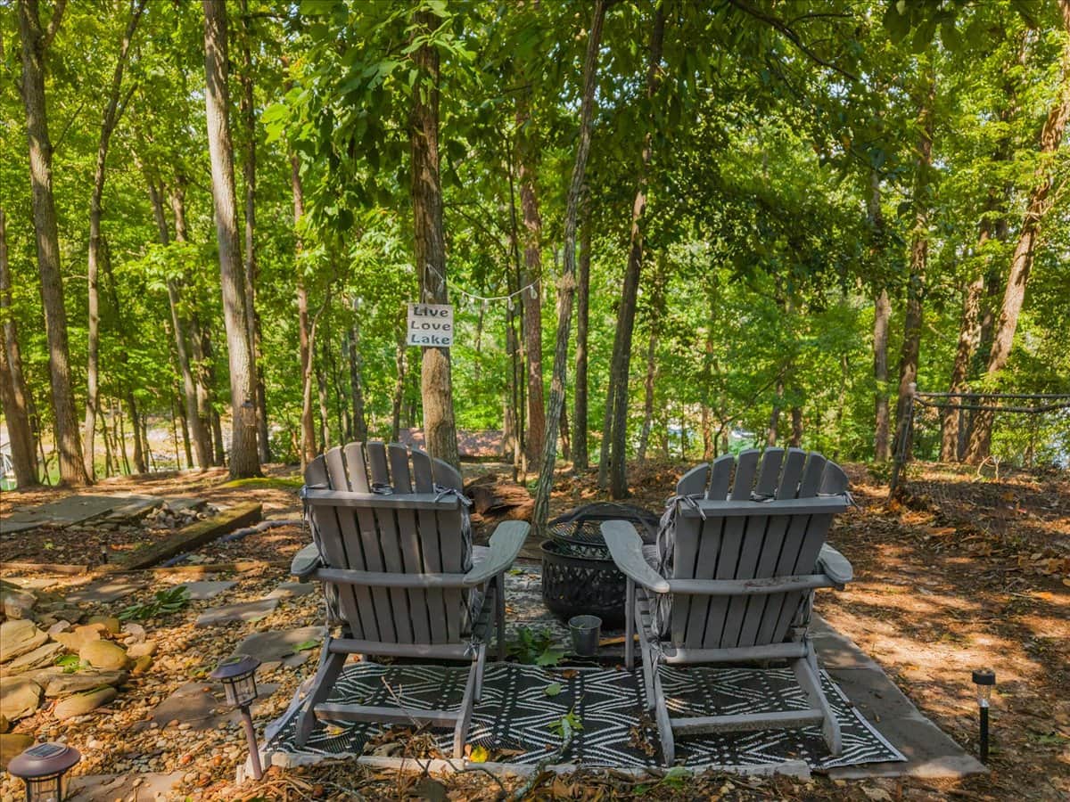 After a long day on the lake, relax by the fire pit and enjoy the scenic view of the woods.