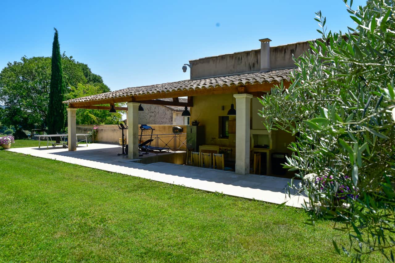 Covered terrace and estate lawn