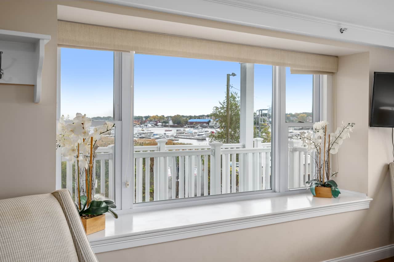 Living Room With All The Views. Watch boats come and go from your couch!