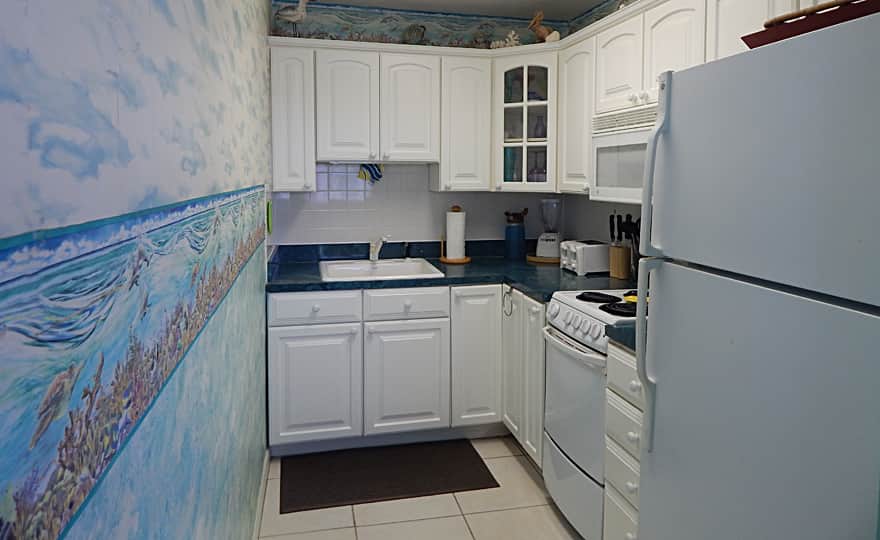 Unit #38 Full size appliances. Kitchen is stocked with essentials to cook complete meals.