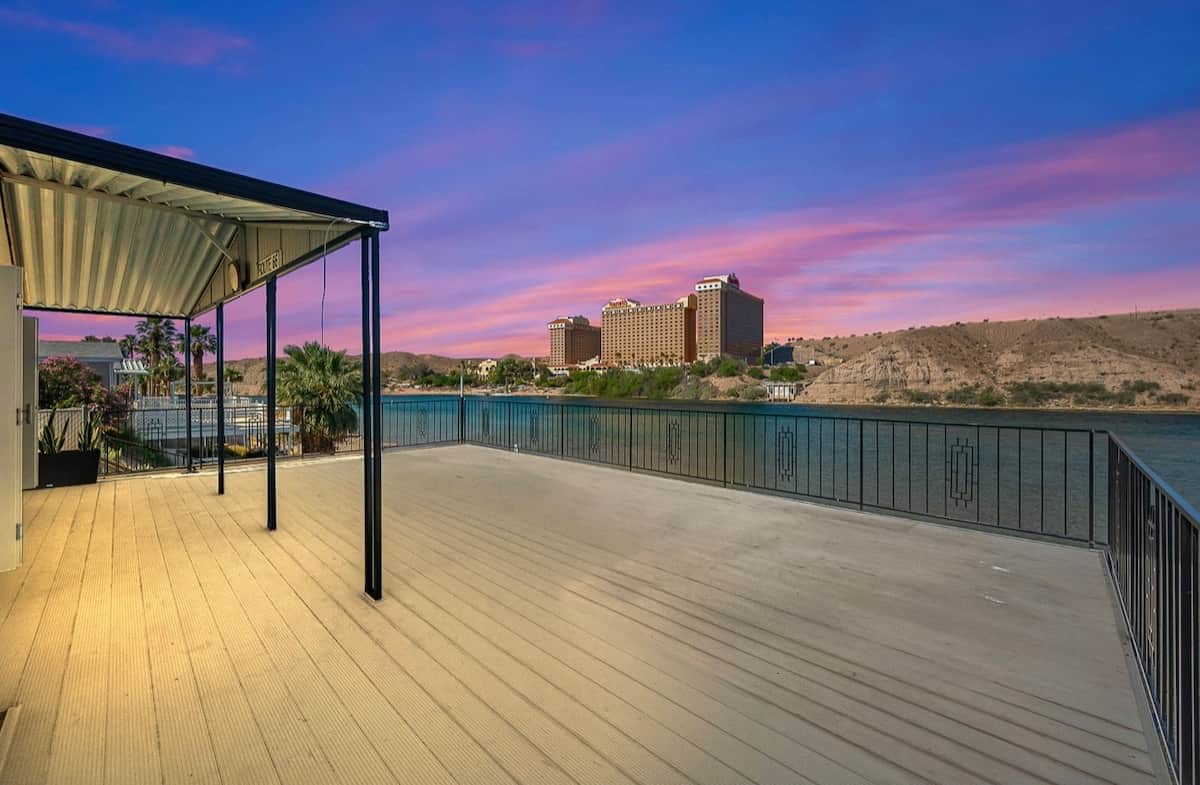 An elevated outdoor retreat featuring breathtaking sunsets and dazzling evening views of the Laughlin casino lights .