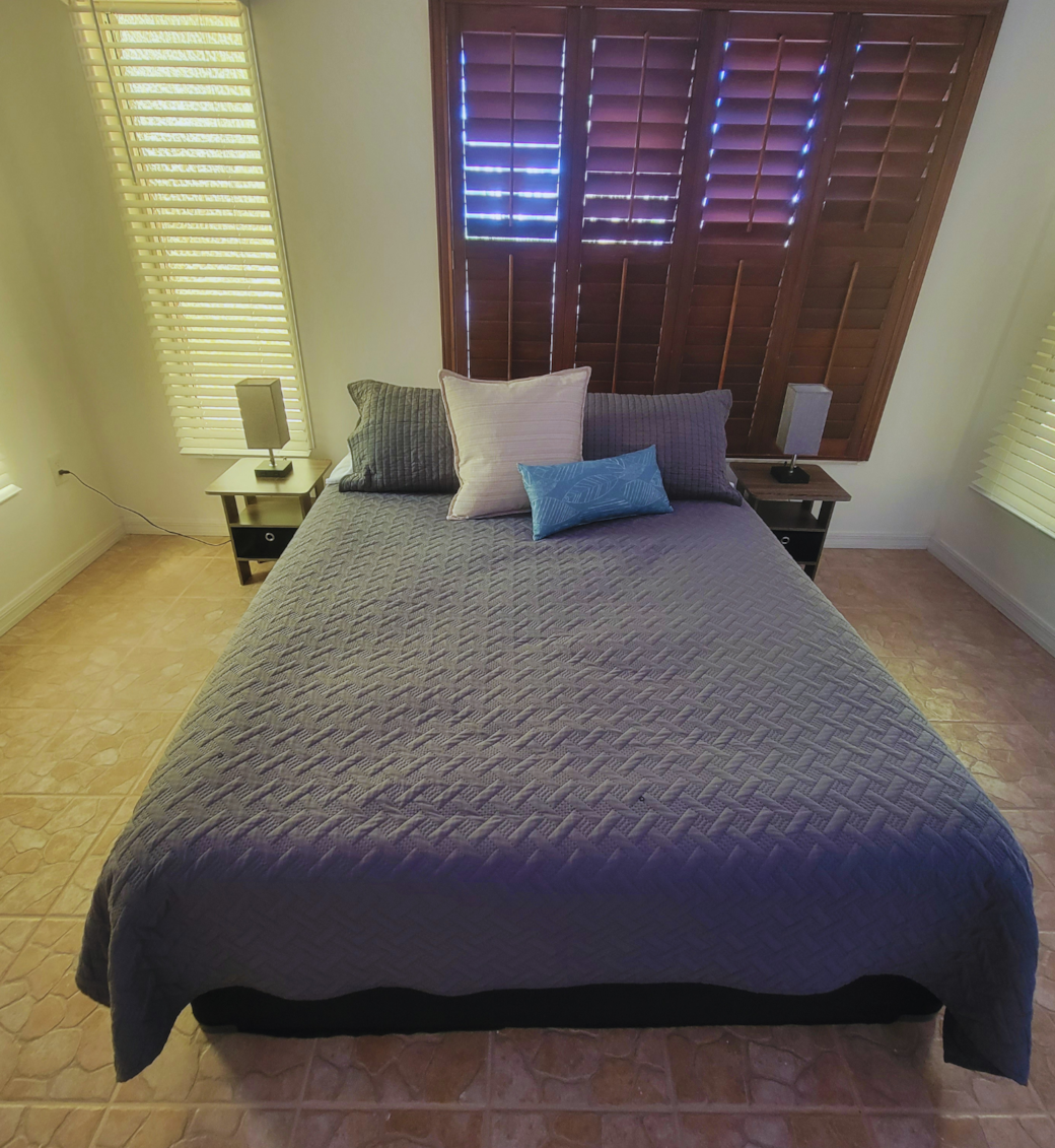 Comfortable queen bed with nightstands, lamps, and soft pillows. Lakeland, FL Comfortable queen bed with nightstands, lamps, and soft pillows. Lakeland, FL